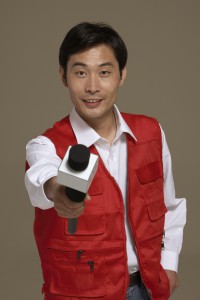 Chinese news reporter holding microphone